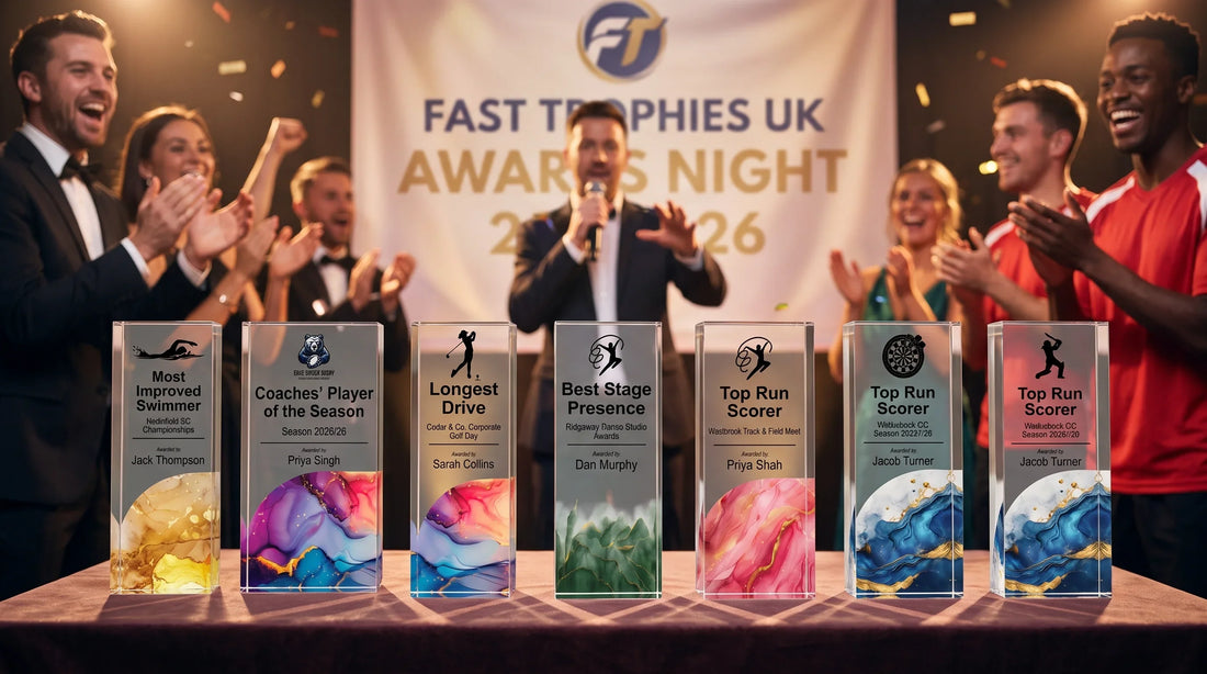 Fast Trophies UK awards night stage showcasing custom acrylic and crystal recognition trophies displayed on a table with cheering guests.