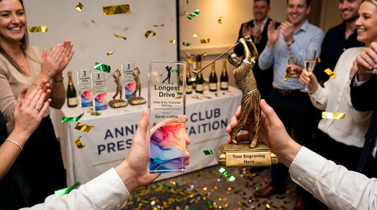 Personalised golf trophies and awards including acrylic and resin designs displayed at a UK golf club presentation night