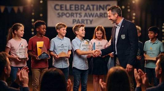 Children receiving sports awards and trophies at a school sports award ceremony with an adult presenter