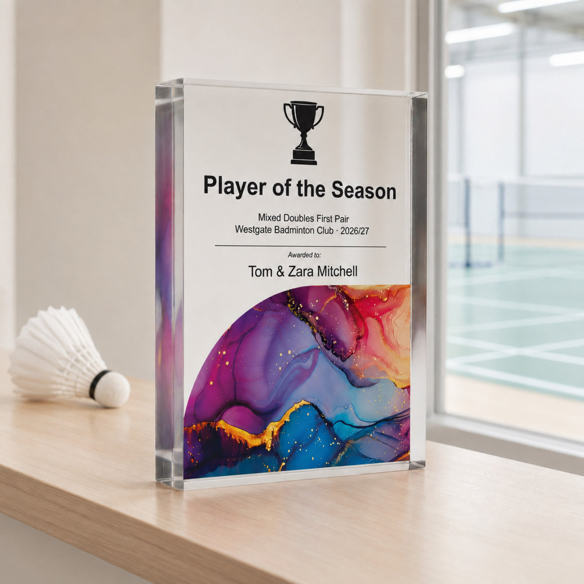 Player of the Season badminton trophy displayed beside a shuttlecock