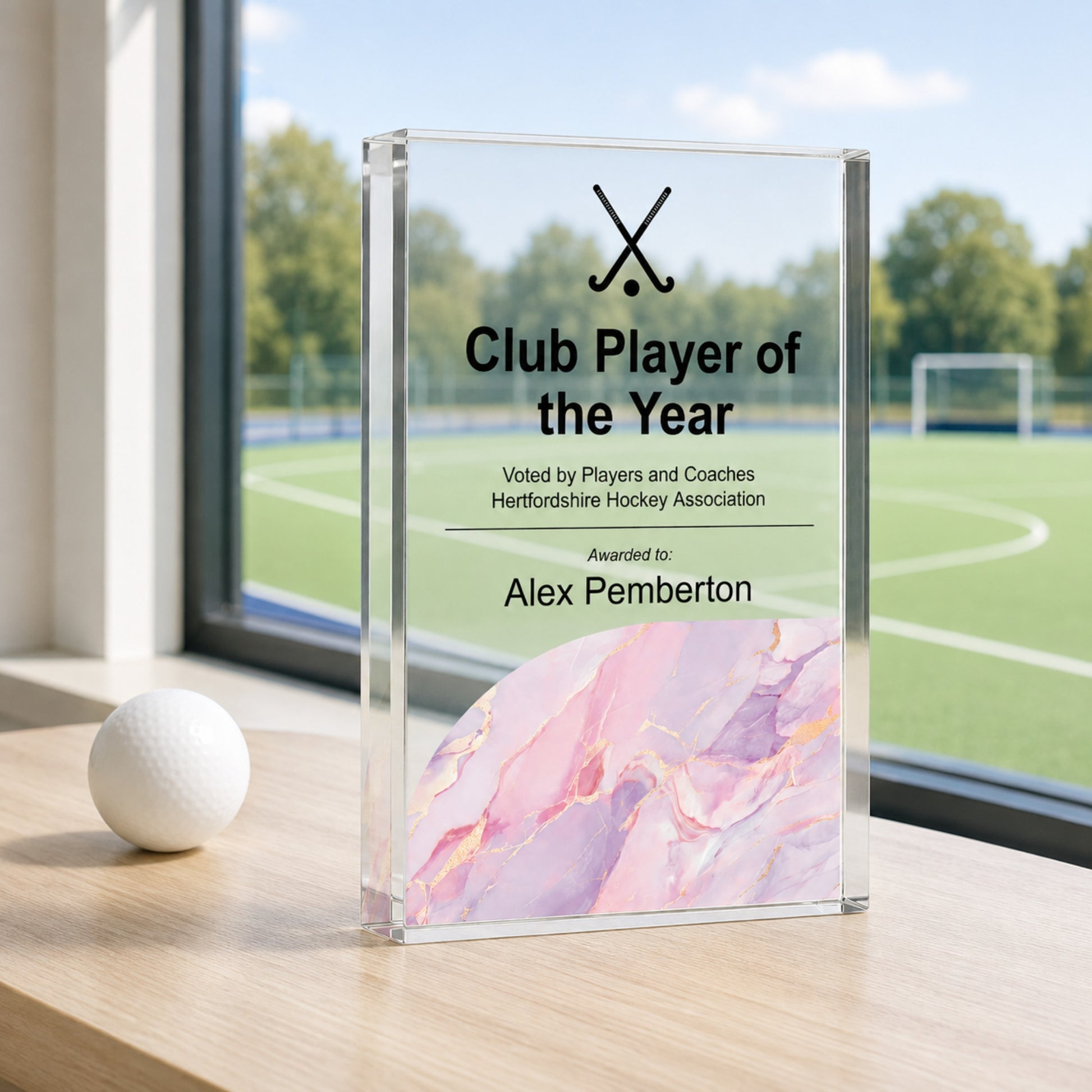 Club Player of the Year hockey trophy with crossed sticks for a presentation evening