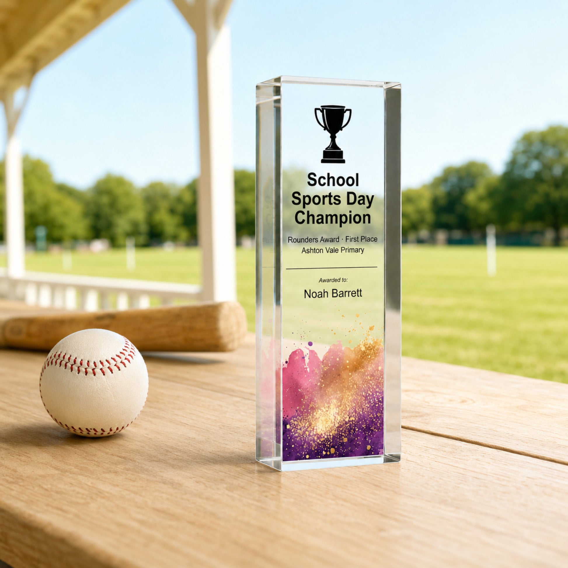 Slim upright School Sports Day Champion rounders trophy beside a ball