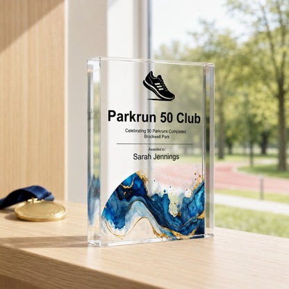 Parkrun 50 Club milestone award in clear acrylic with a running shoe symbol