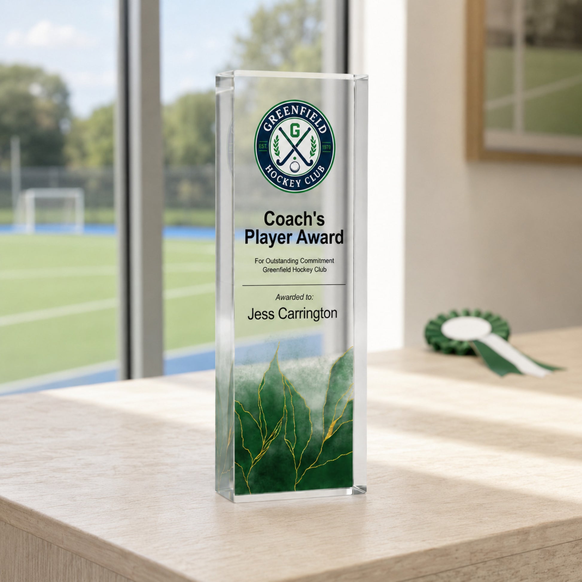 Slim upright Coach's Player Award hockey trophy with a school crest