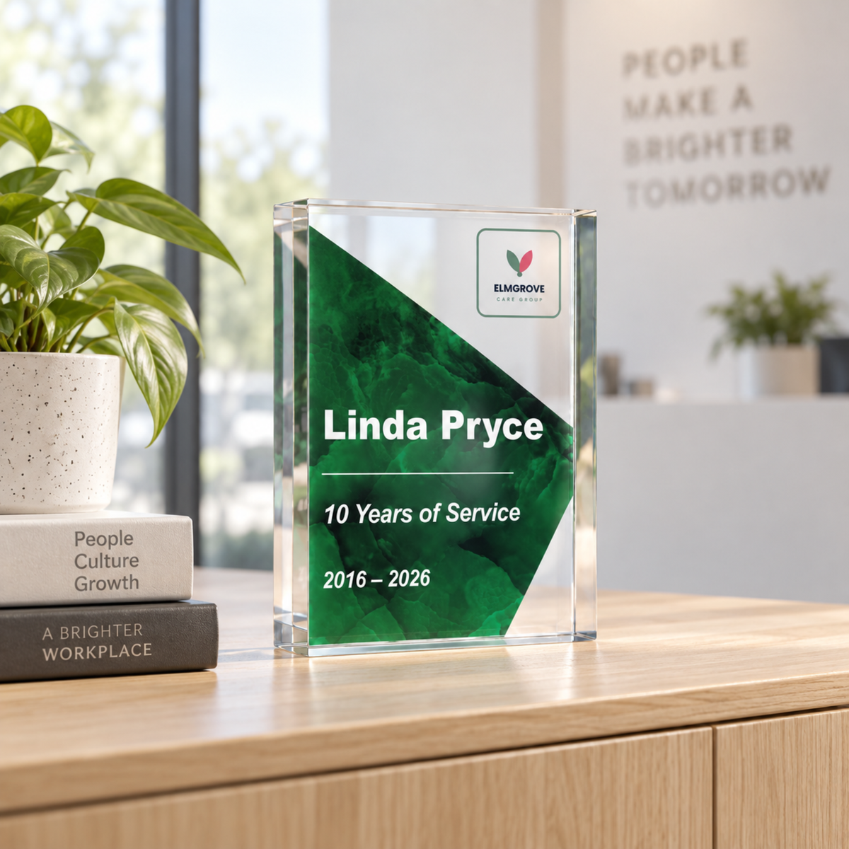 Corporate long service award with company logo marking 10 years of service, forest green acrylic